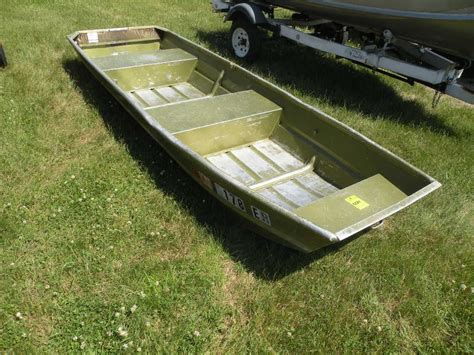 12ft jon boat - Overview. The TRACKER® TOPPER™ 1236 jon boat is easy to transport on top of a vehicle or in a truck bed—and it can still accommodate two anglers and their gear! It also features a wide 36" bottom for added stability. Crafted with rugged 5052 aluminum alloy, the TOPPER 1236 is backed by a 3-year structural limited warranty.